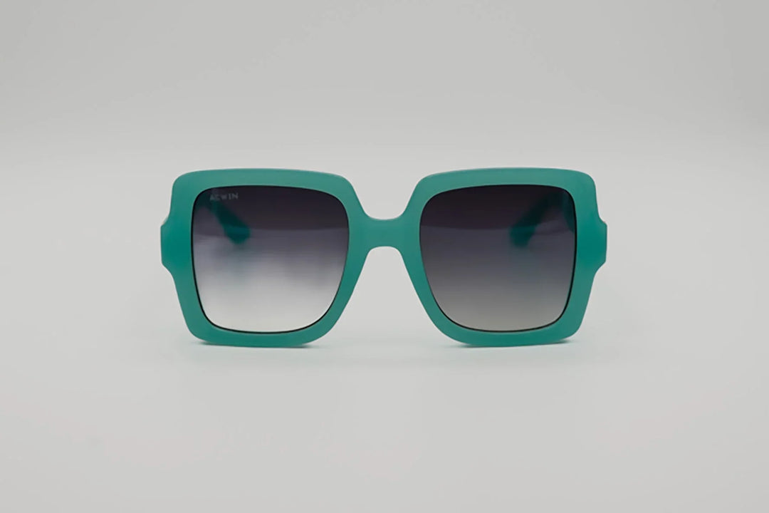 Vista frontal gafas de sol Burgos cuadradas oversize en color turquesa mate.