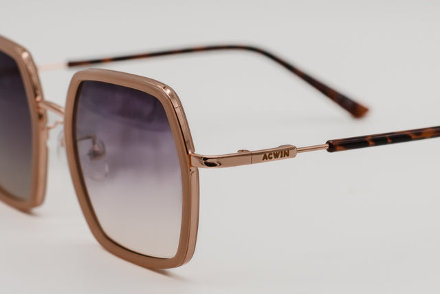 Detalle macro de la varilla metálica oro rosa y el logo del modelo Houston.