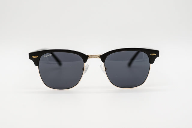 Vista frontal gafas de sol Madrid estilo Clubmaster en negro mate y dorado.