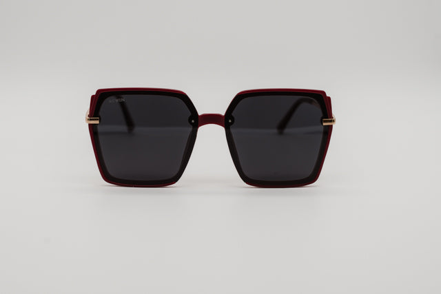 Vista en perspectiva gafas de sol Melbourne geométricas color burdeos mate y oro.