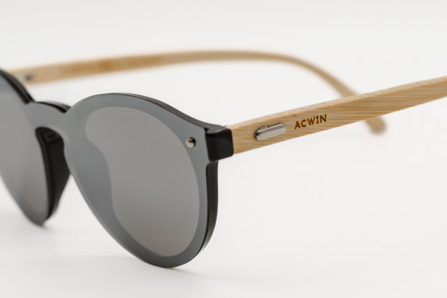 Detalle macro de la conexión entre el frontal negro y la varilla de madera del modelo Nairobi.