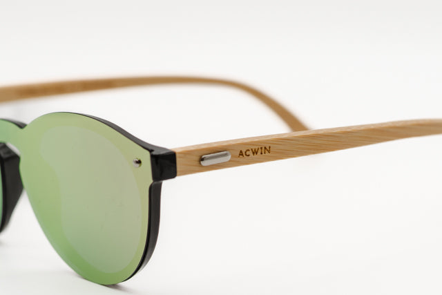 Detalle macro de la varilla de madera y la lente verde del modelo San Francisco.