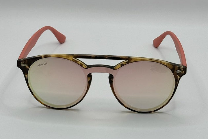 Vista en perspectiva gafas de sol Venus carey con varillas rosa y lente espejo.